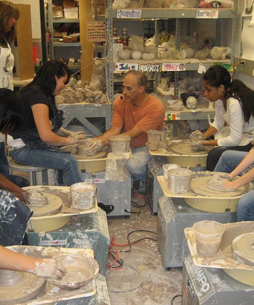 7. group hands-on potters wheel lesson at high school
