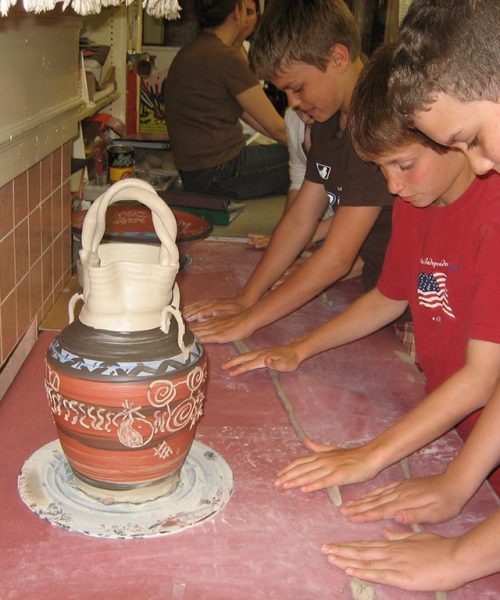 students rolling coils for group vase