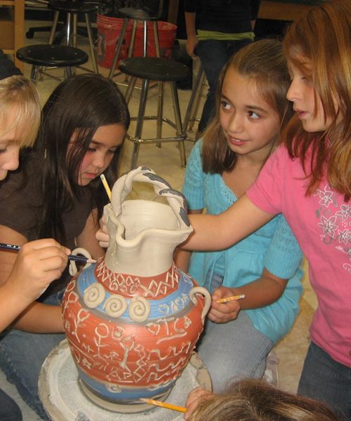 students working on group vase